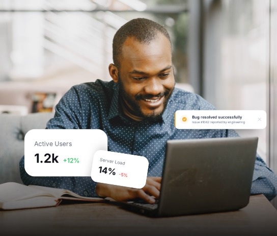 Developer at laptop with active users, server load stats, and engineering bug fix notification